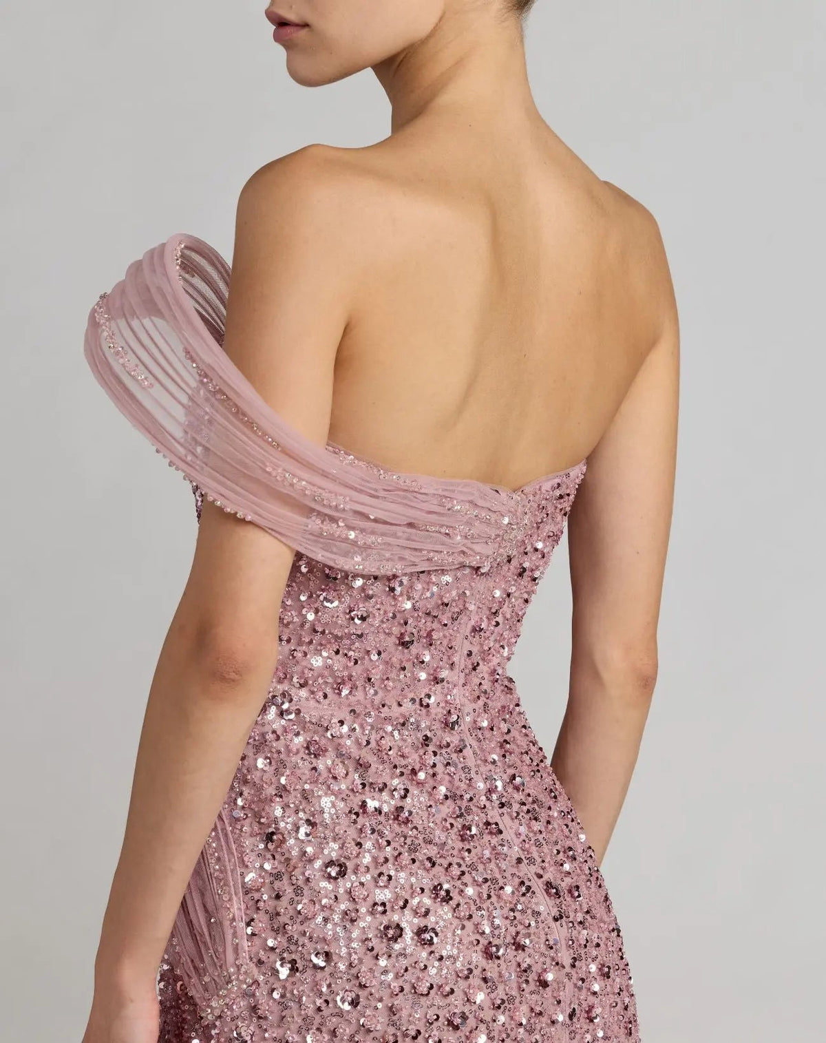 37085-Blush-BK.jpg: Back view of the Blush formal dress highlighting the uniform sequin pattern and the elegant small sweeping train.