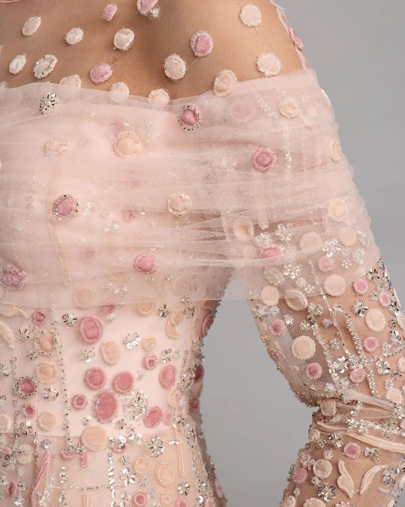 Pink embroidered illusion long sleeve ball gown