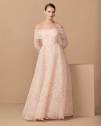 Pink embroidered illusion long sleeve ball gown