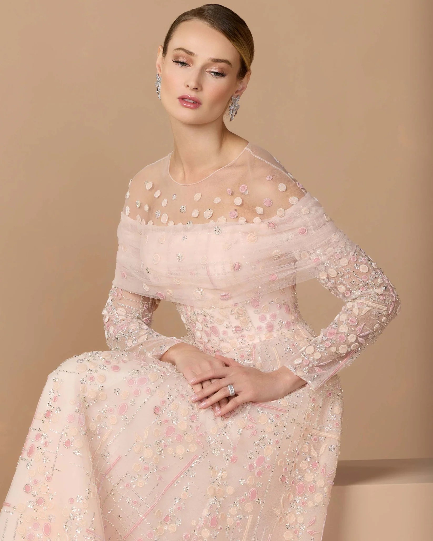 Pink embroidered illusion long sleeve ball gown