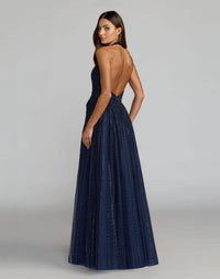 Back view of model in Mac Duggal 37120 midnight open-back gown with beaded tulle