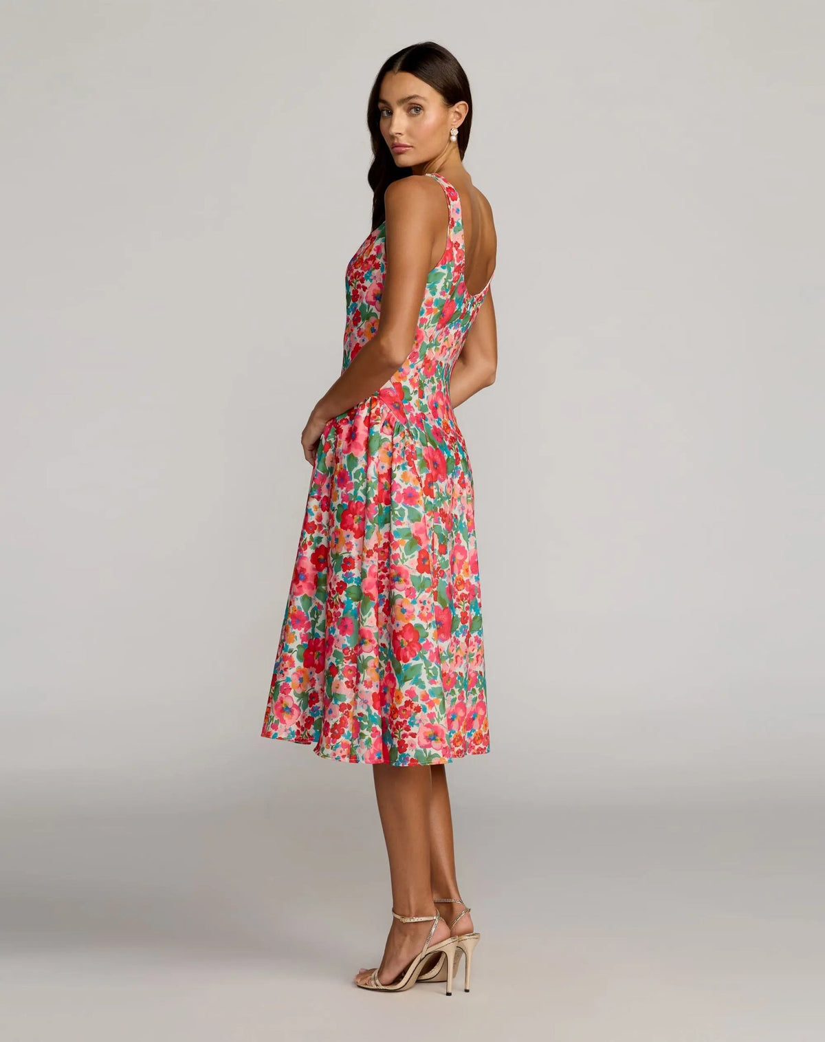 Back view of the Pink Multi crepe dress highlighting the elegant scoop back design and concealed rear zipper closure.
