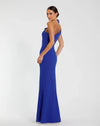 Woman wearing a blue evening gown on a white background