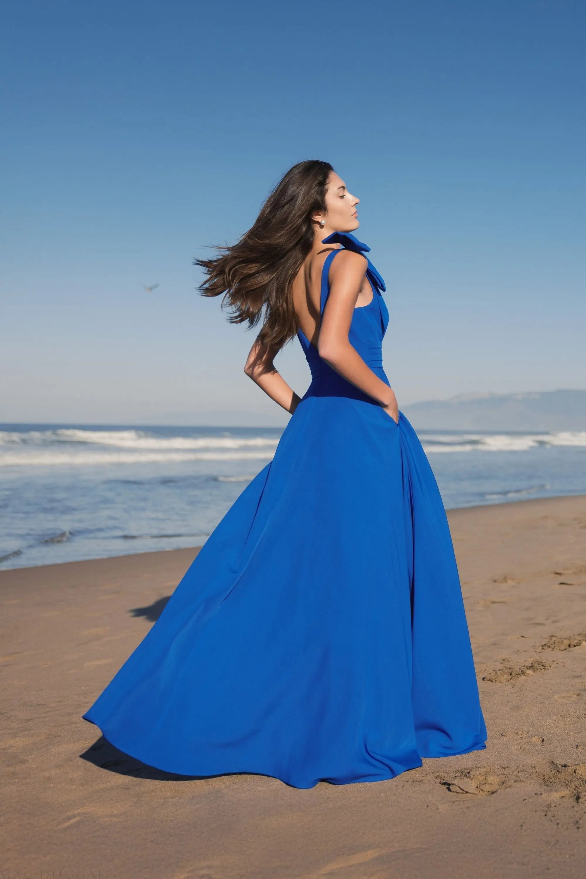 Mac Duggal #49972 cobalt sleeveless plunge neck ball gown with bow detail
