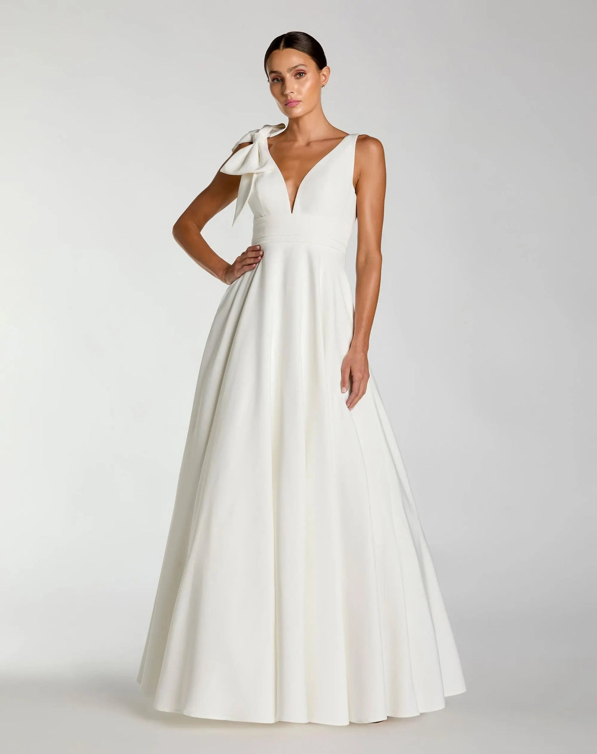 Mac Duggal #49972 white sleeveless plunge neck ball gown with bow detail