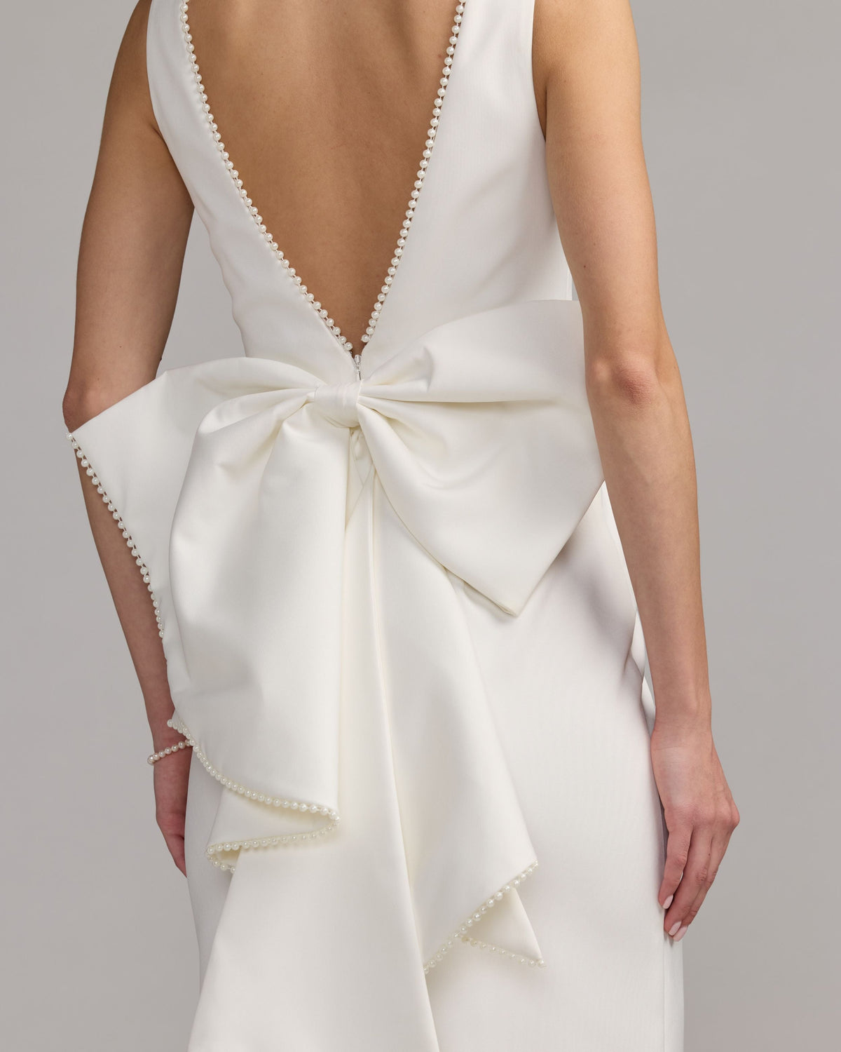 Mac Duggal #50169 ivory pearl trim bow back midi dress close-up