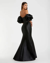 Black evening gown with ruffled sleeves on a white background