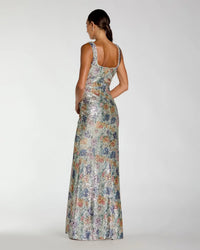 Woman wearing a floral dress with a white background