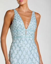 Light blue sequin dress with a plunging neckline on a plain background