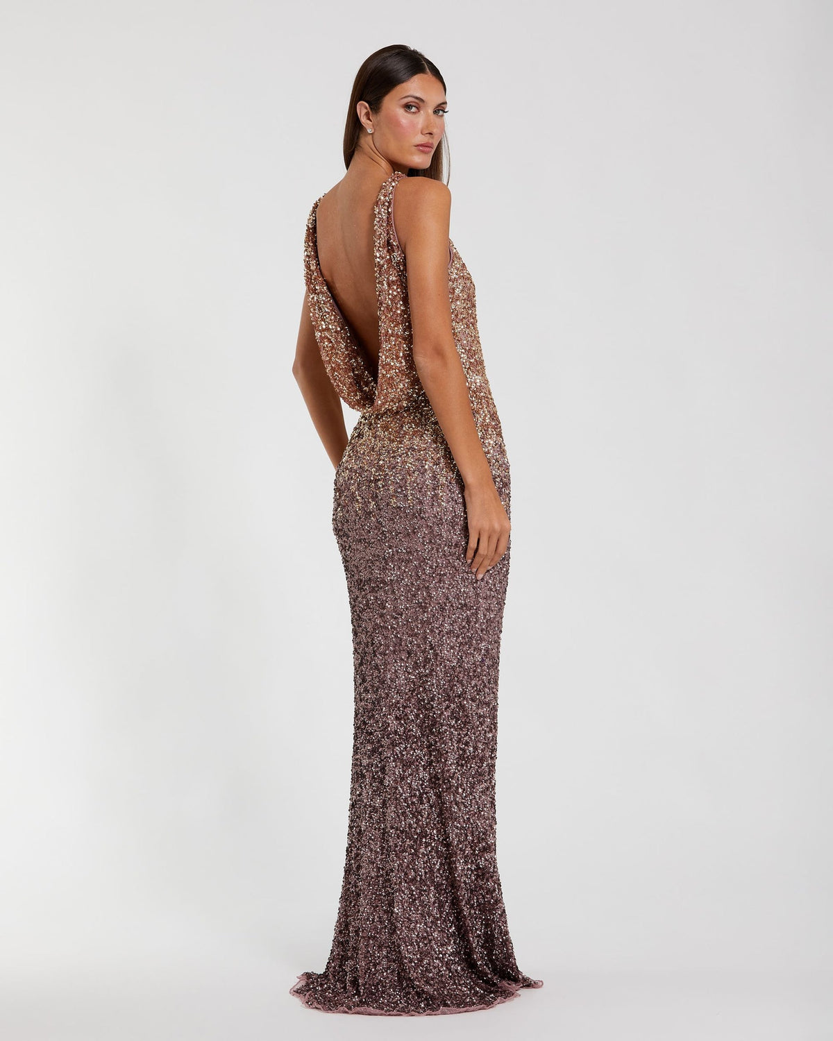 Back view of a Gold Amethyst ombré sequin gown featuring a dramatic cowl back and concealed zipper.