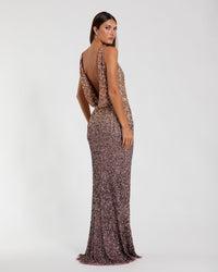 Back view of a Gold Amethyst ombré sequin gown featuring a dramatic cowl back and concealed zipper.