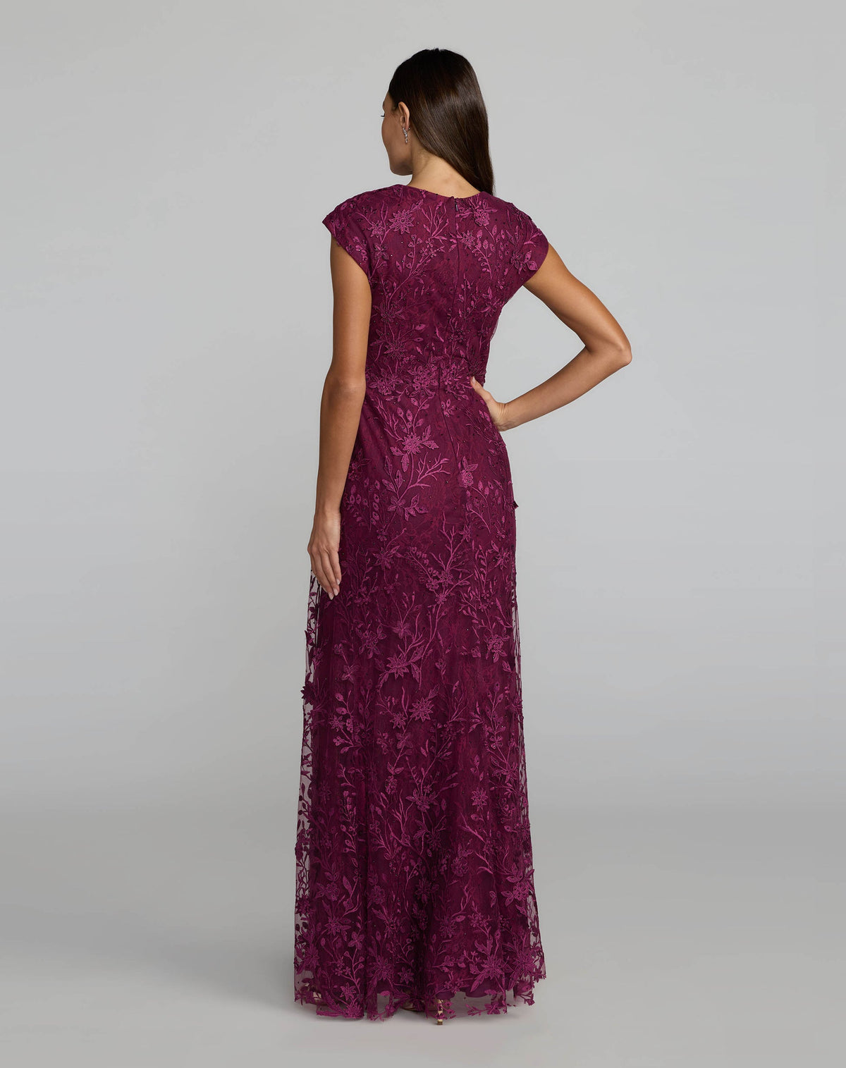 Back view of an Amethyst floor-length evening gown with a concealed zipper and cap sleeves.