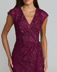 Close-up of the V-neck bodice and embroidered mesh details with heat-set rhinestones on an Amethyst gown.