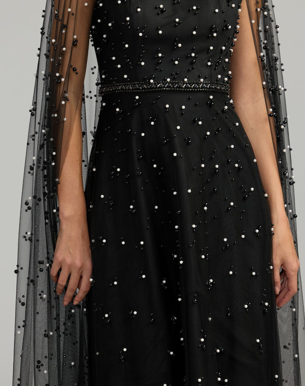 Mac Duggal #69025 black ivory gown beaded neckline and cape sleeve detail