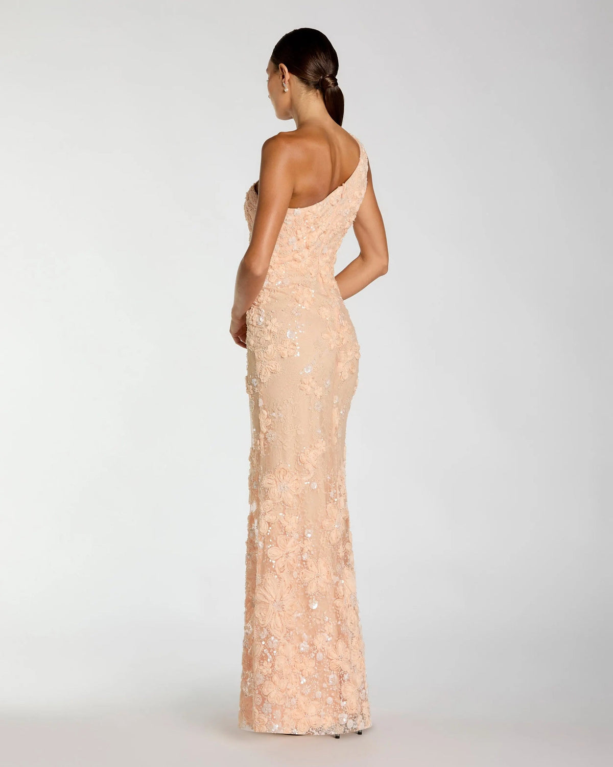 Back-view-of-fitted-one-shoulder-peach-formal-dress-with-lace-overlay