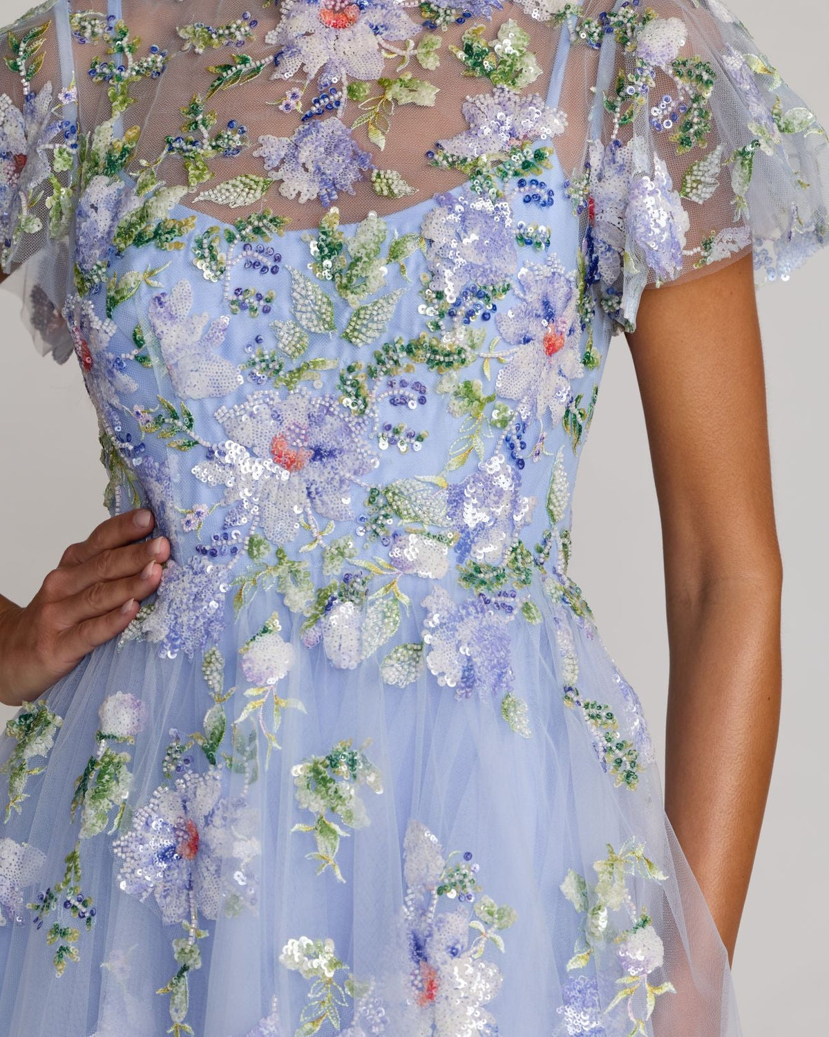 Close-up of floral embroidery, sequins, and flutter sleeves on Mac Duggal 69108 dress