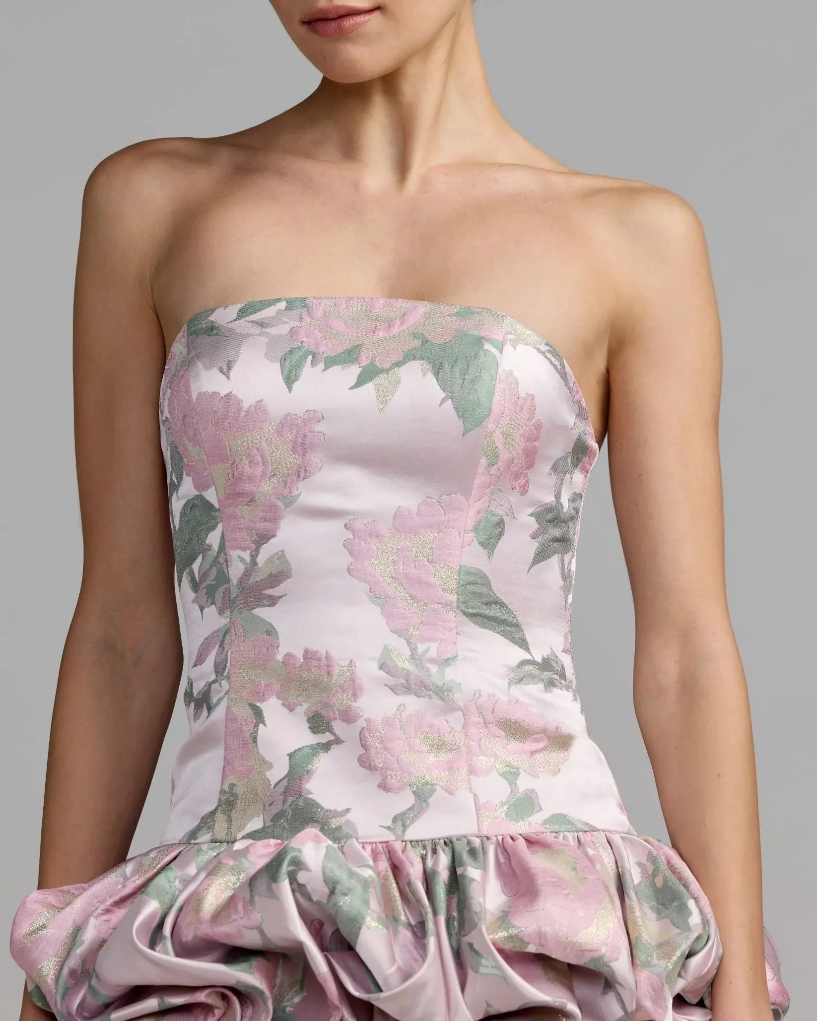 Floral strapless dress on a plain background