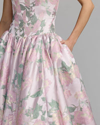 Floral patterned dress on a plain background