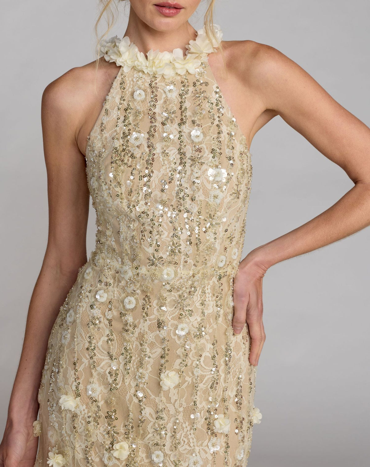 Close-up detail of halter neckline with 3D floral accents on Mac Duggal 69189 butter gown