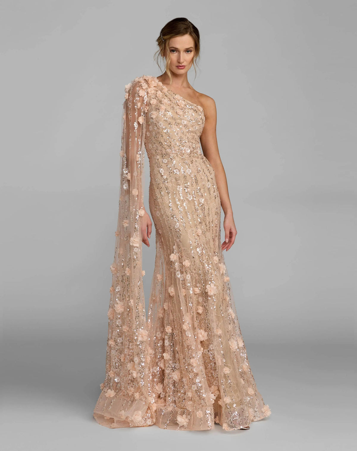 Main lifestyle shot of a model wearing the blush embroidered lace mermaid gown.