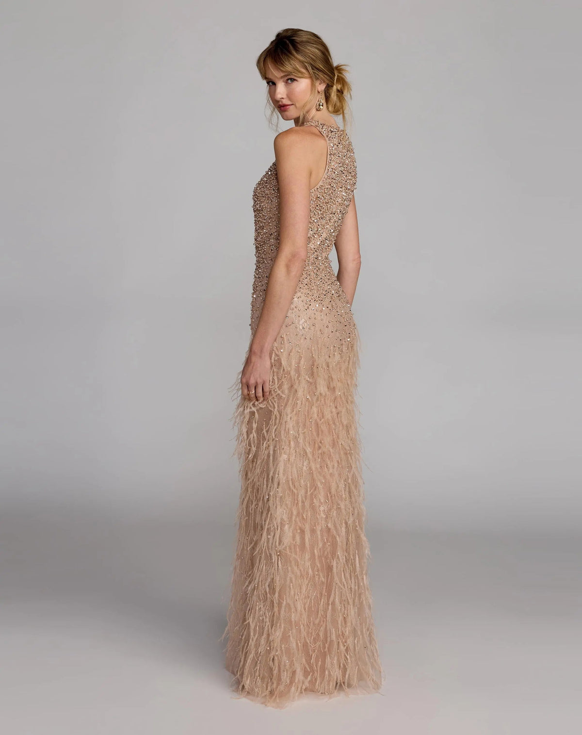 Back view of the Porcelain formal dress showcasing the continuous high-neck lace pattern, rear zip closure, and feathered texture.