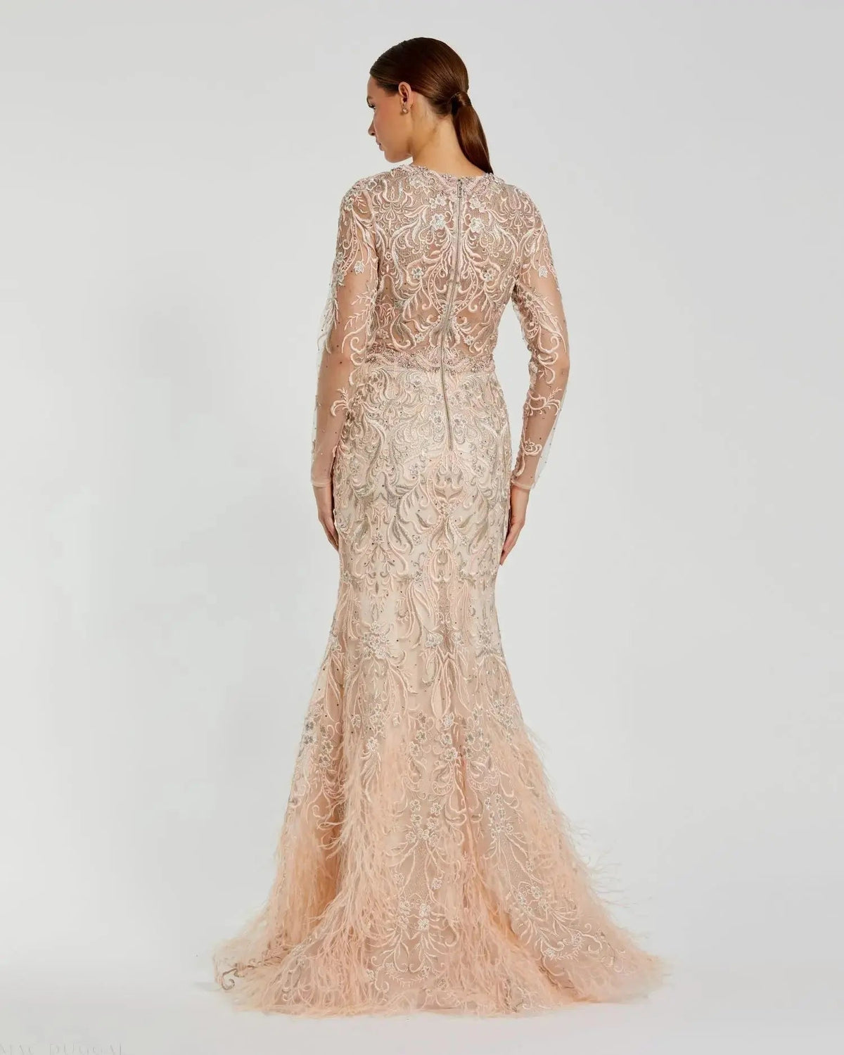 Full length back view of Mac Duggal 79267 blush embroidered gown featuring sheer long sleeves and feather trim hem