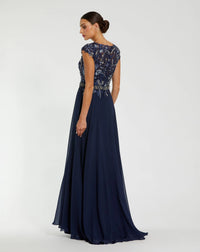 Navy evening gown with intricate top design on a white background