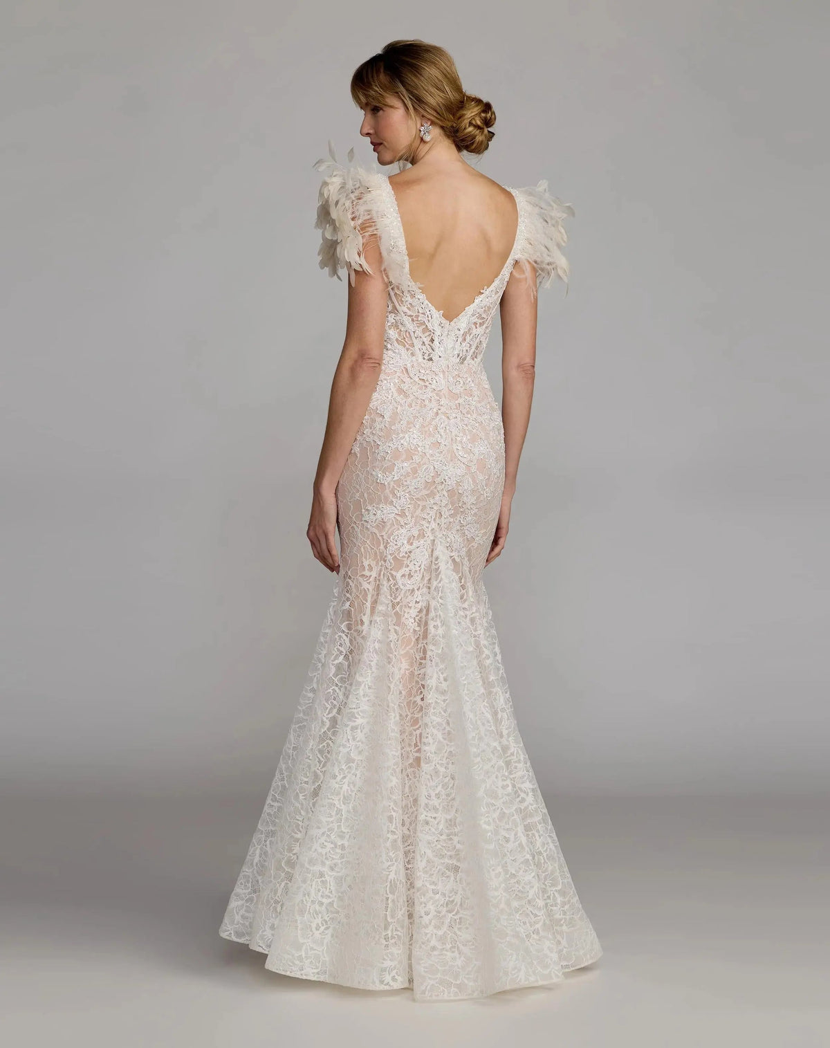 Full length back view of Mac Duggal 79453 ivory lace mermaid gown featuring a deep v-back design