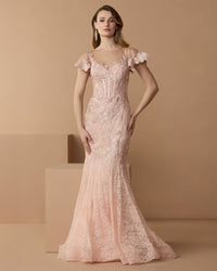 Full-length front studio view of the blush mermaid gown with floral embroidery and flutter cap sleeves.