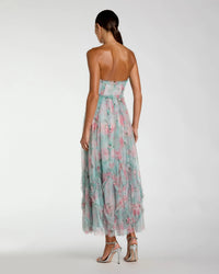 Woman wearing a floral dress on a white background