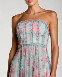 Strapless dress with floral pattern on a plain background