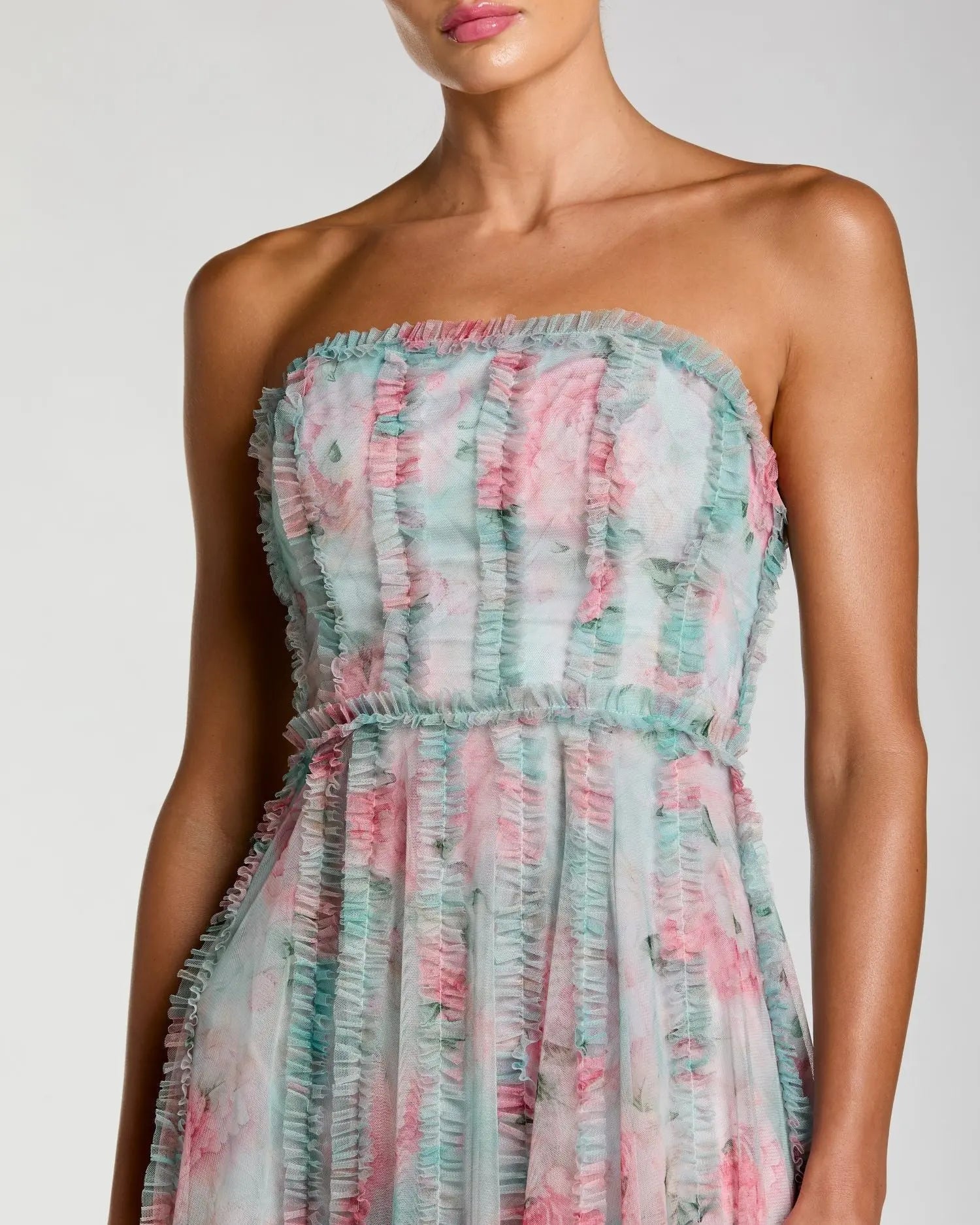 Strapless dress with floral pattern on a plain background