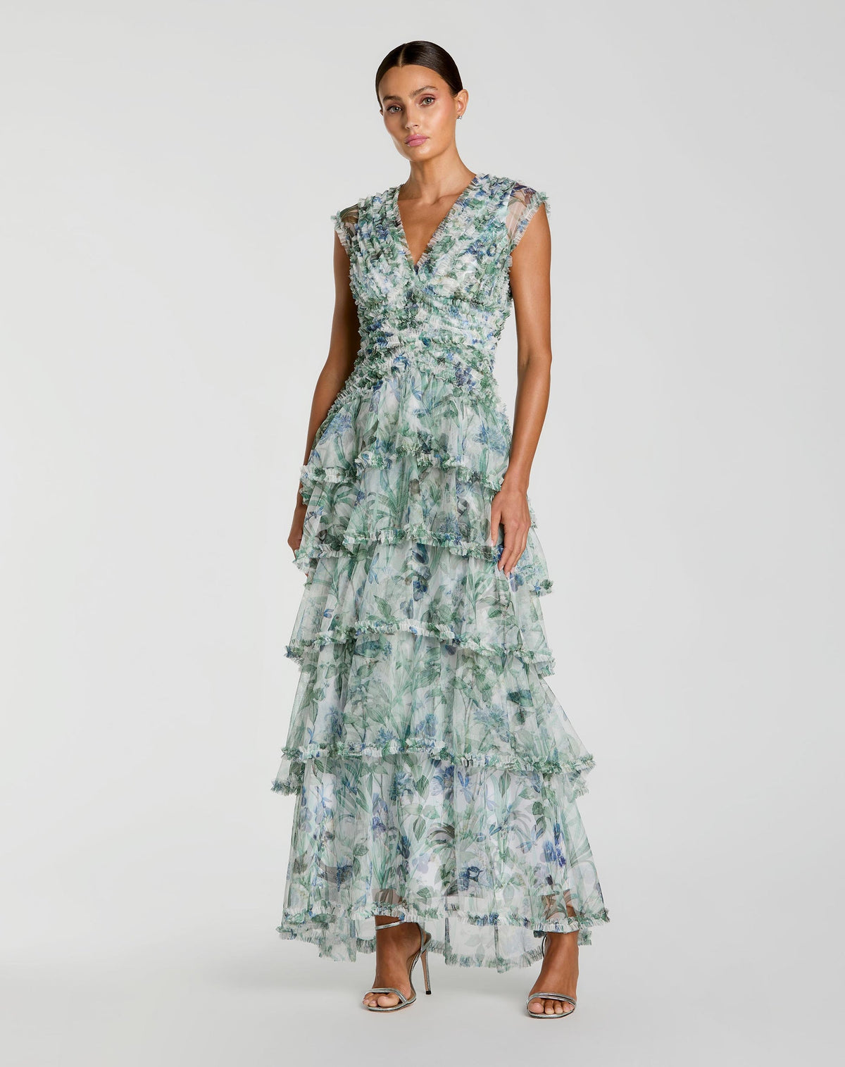 Studio shot of model wearing Mac Duggal Blue Floral V Neck Tiered Ruffle Maxi Dress #8423