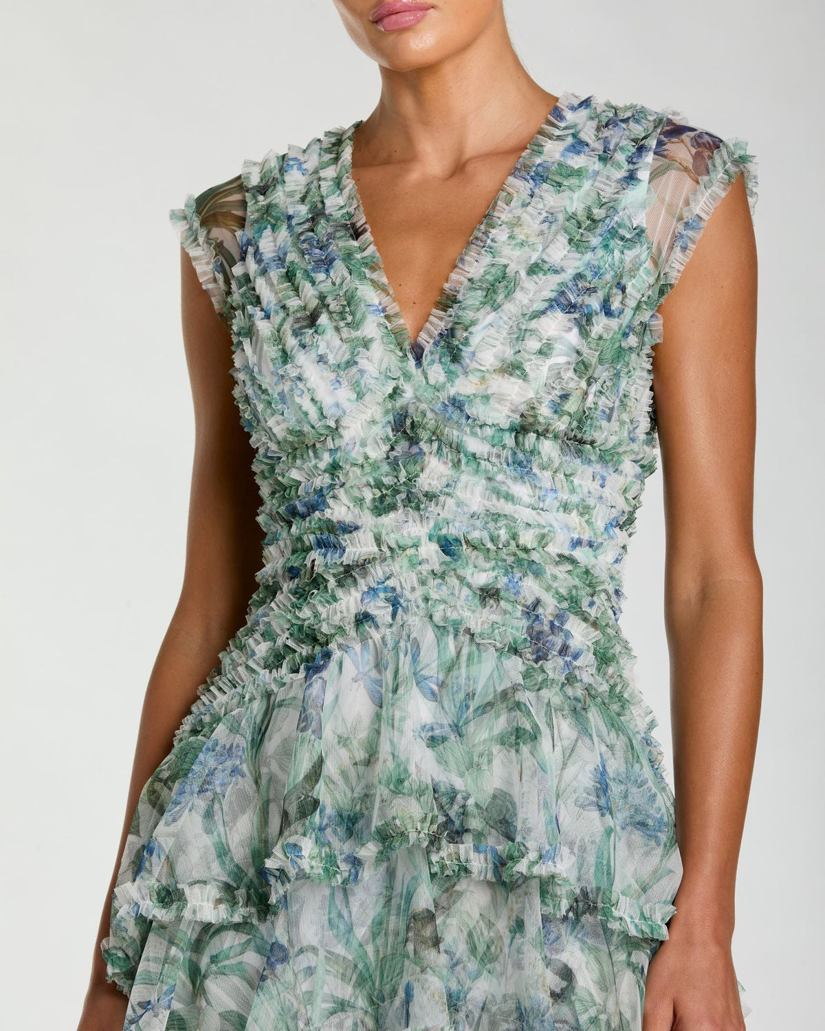 close up studio shot of model wearing Mac Duggal Blue Floral V Neck Tiered Ruffle Maxi Dress #8423