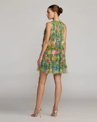 Woman wearing a floral dress on a plain background