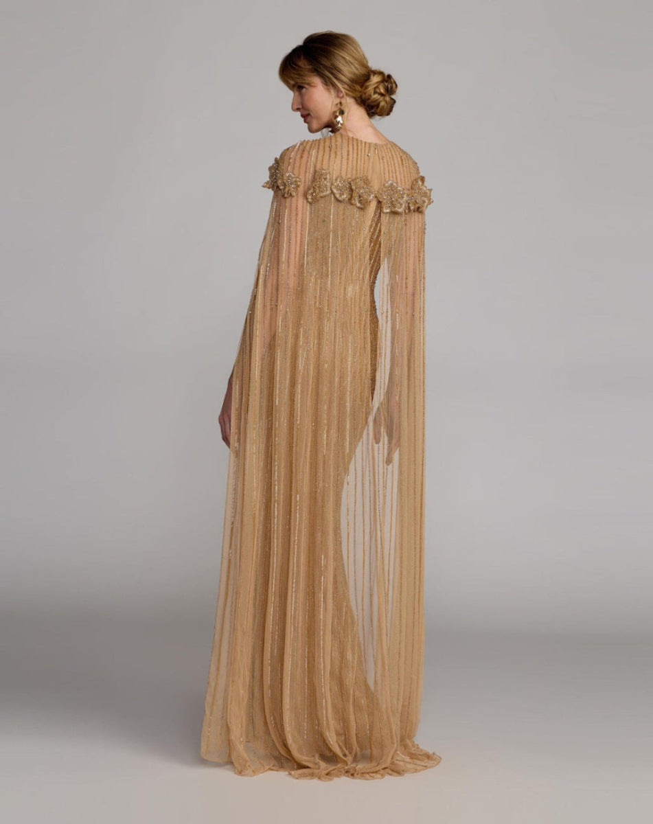 Full length back view of Mac Duggal 86012 Nude Gold gown featuring an unlined sheer cape with vertical hand beading