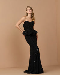 Mac Duggal #86018 black embellished peplum gown lifestyle shot