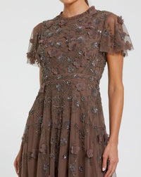 Brown dress with floral embroidery on a white background