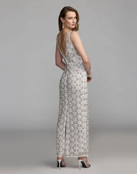 Back view of the Ivory formal dress highlighting the elegant V-back design, matching lattice work, and bottom back slit.