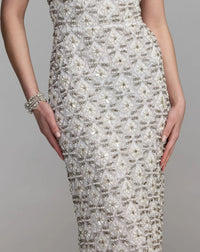 Close-up studio view focusing on the V-neckline, embellished straps, and the high-shine texture of the hand-applied pearls and rhinestones.