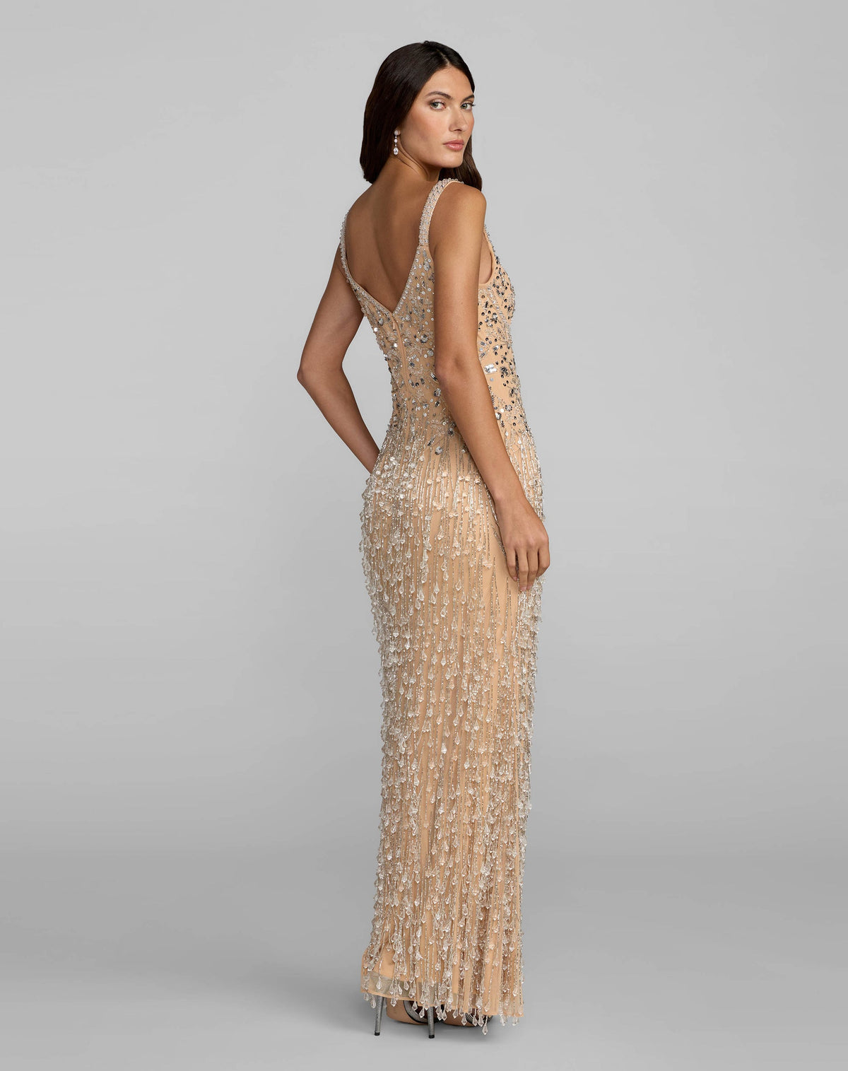 Back view of silver nude beaded column gown with V-back and concealed zipper.