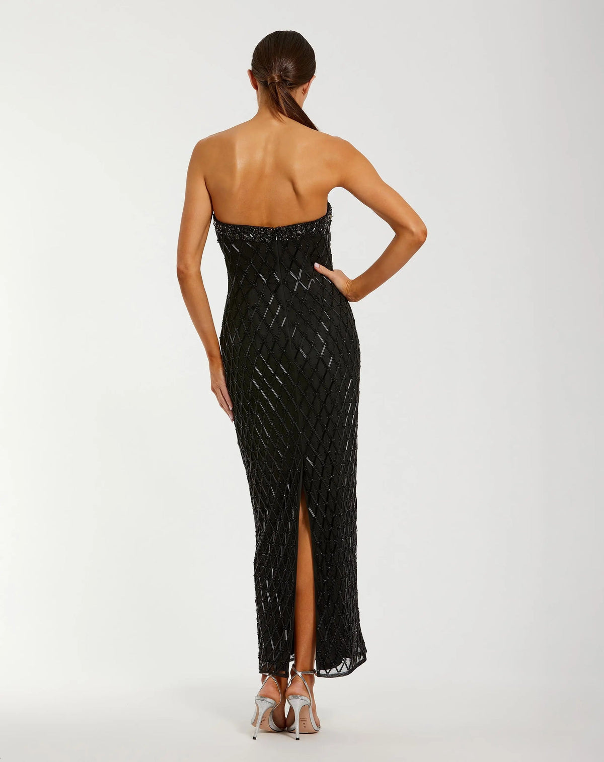 Back view of Mac Duggal 94288 black strapless evening gown featuring back slit and concealed zipper