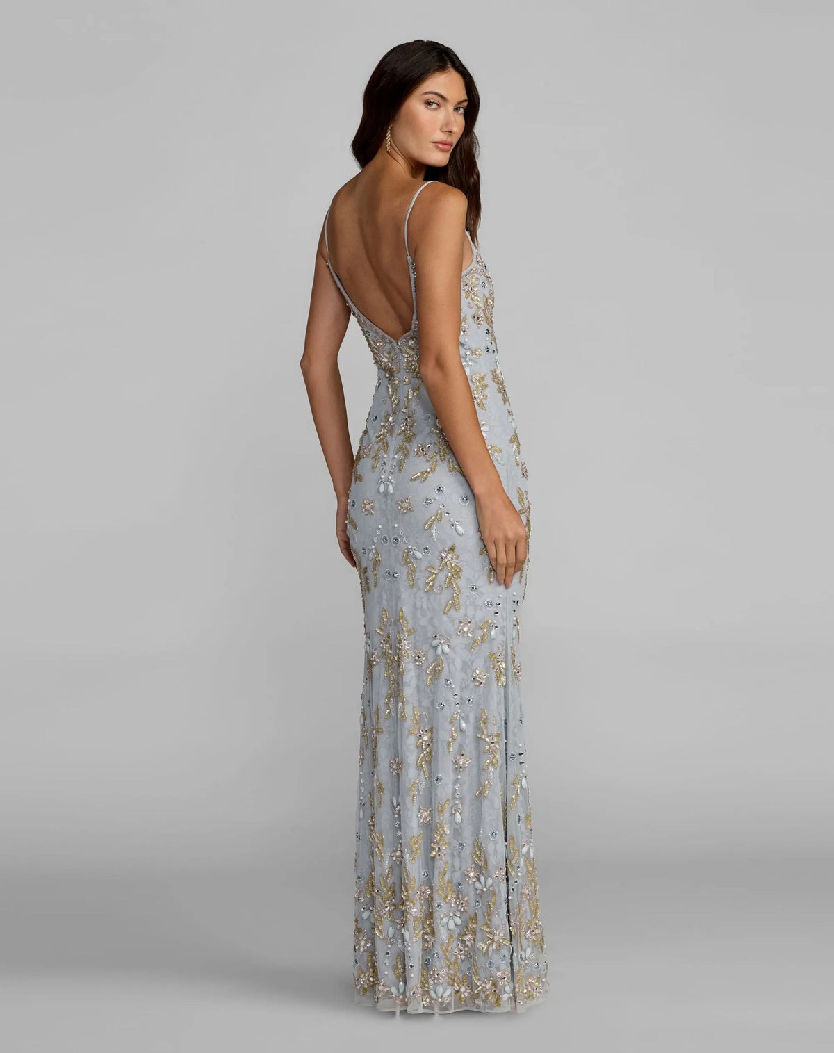 studio shot full lengthback view model wearing powder blue embellished lace V-neck gown, style 94311, intricate embroidery, floor-length formal evening dress.