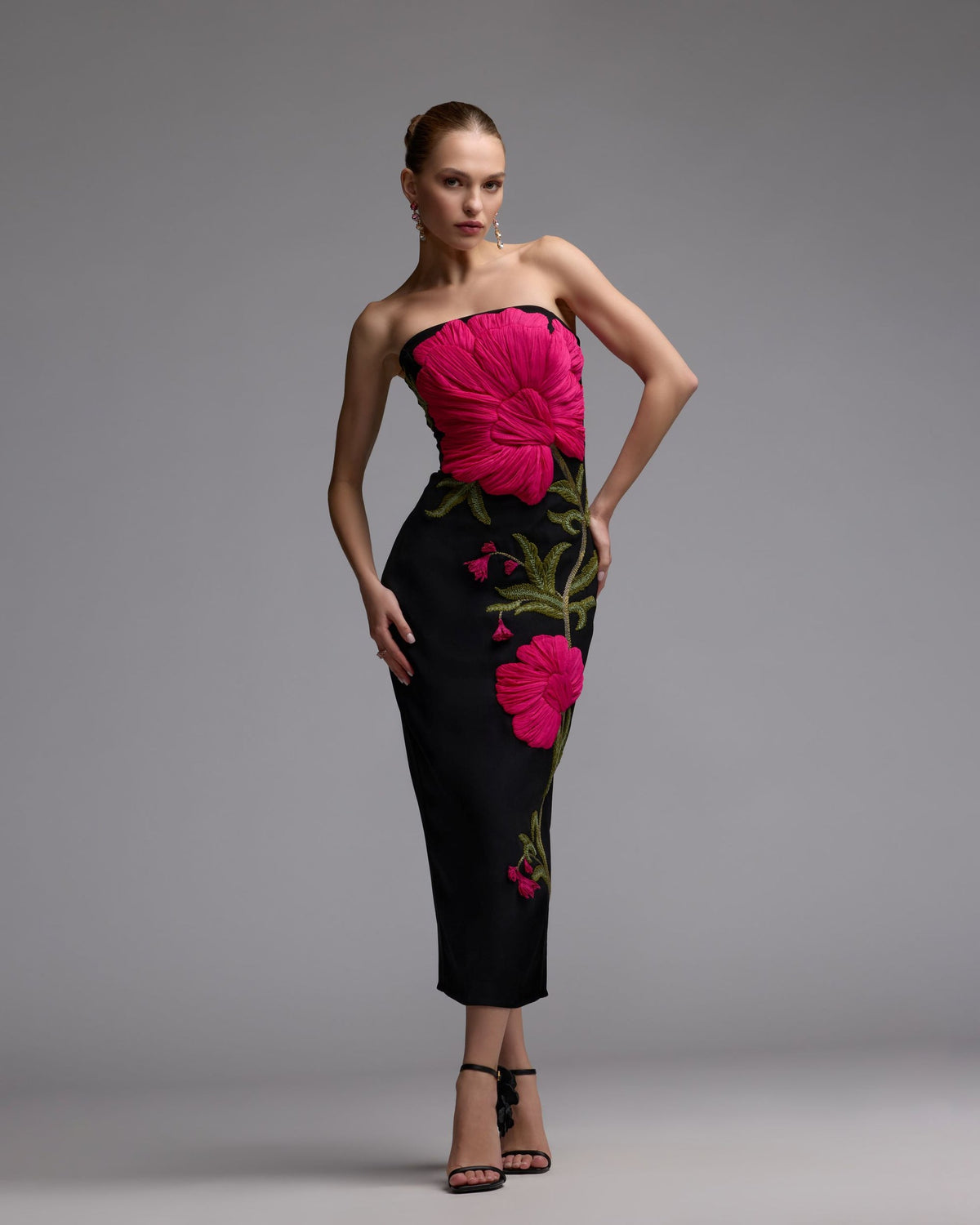 Detailed-embroidery-and-sculptural-botanical-accents-on-black-gown