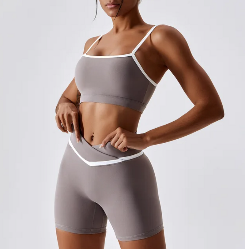 Give your off-duty wardrobe a new lease of life with this monochrome gym crop top and shorts set. This cropped cami top with hidden padding is brought to you in a monochrome grey and white style with white piping straps and a seamless design. This gym fit set is everything you need for your everyday errands, pilates or for your gym session.  Suitable for yoga, exercise, fitness, running, any type of workout, or everyday use. this sportswear set is soft, comfortable and flattering. grey