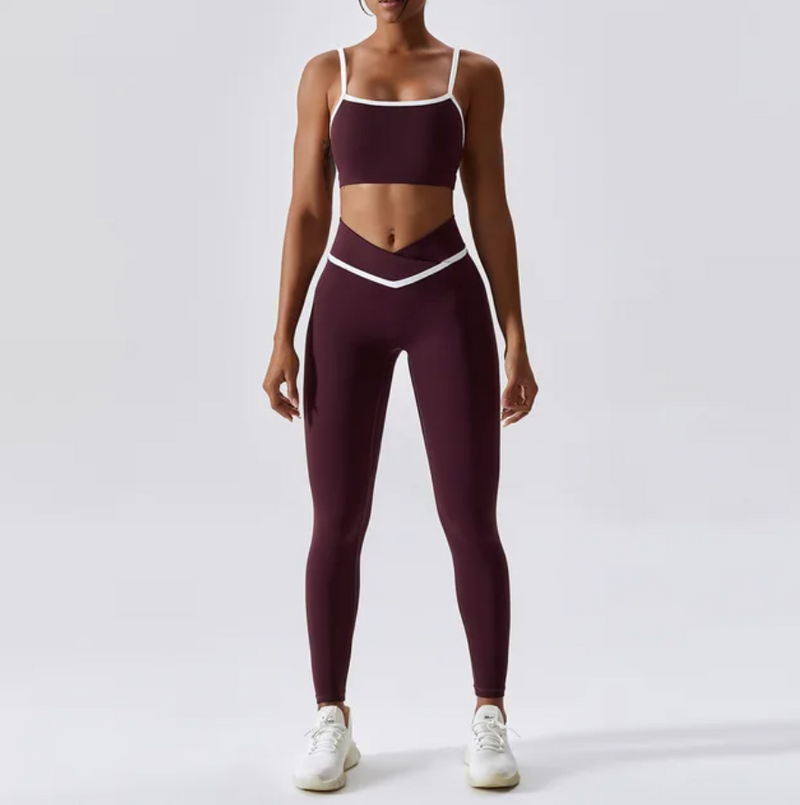 Give your off-duty wardrobe a new lease of life with this monochrome gym crop top and full length leggings set. This cropped cami top with hidden padding is brought to you in a monochrome retro red and white style with white piping straps and a seamless design. This gym fit set is everything you need for your everyday errands, pilates or for your gym session. 