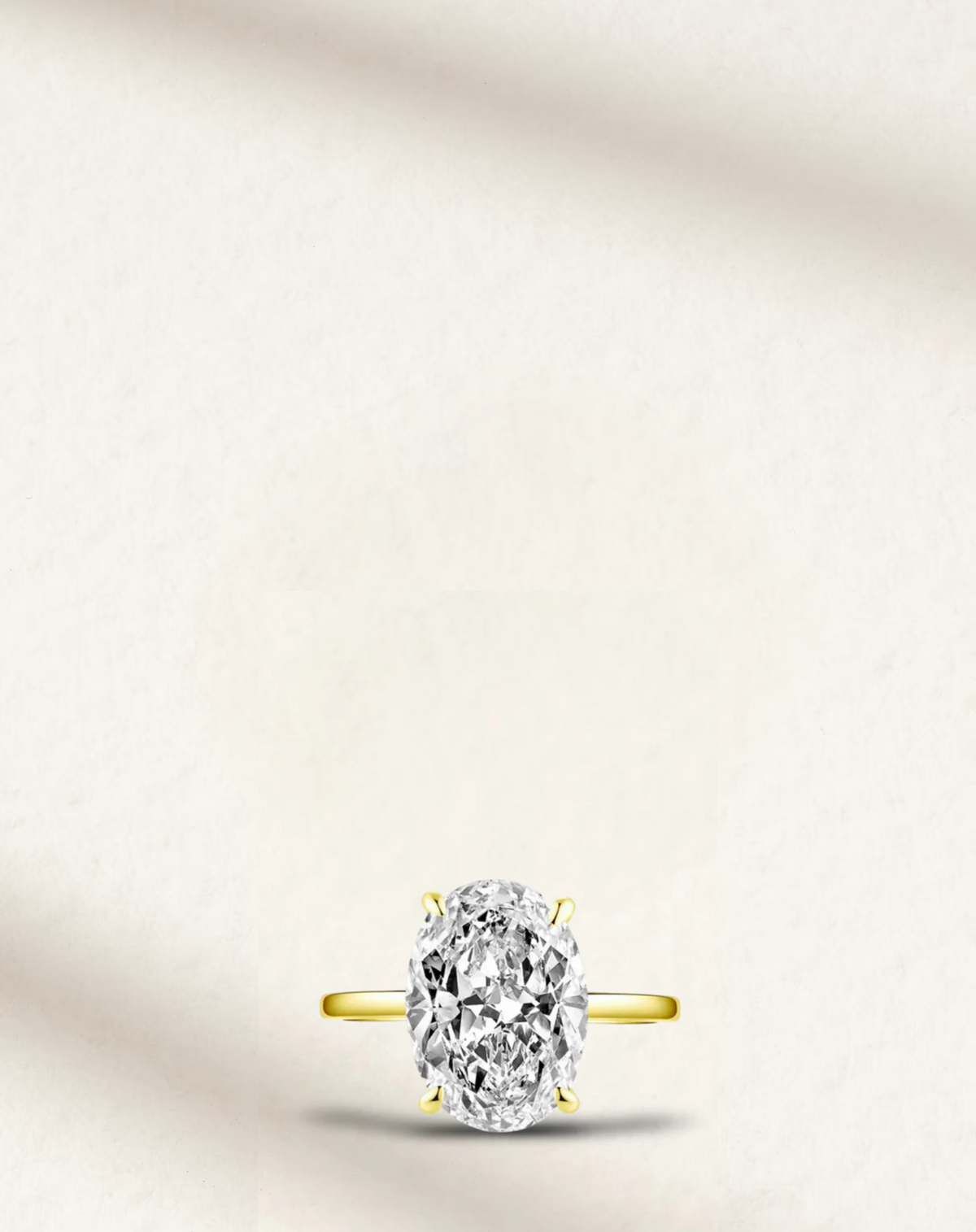 hailey bieber engagement ring dupe, oval diamond on yellow band