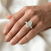 Pear shape engagement ring worn on hand