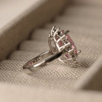 Pink oval sapphire halo cocktail ring styling