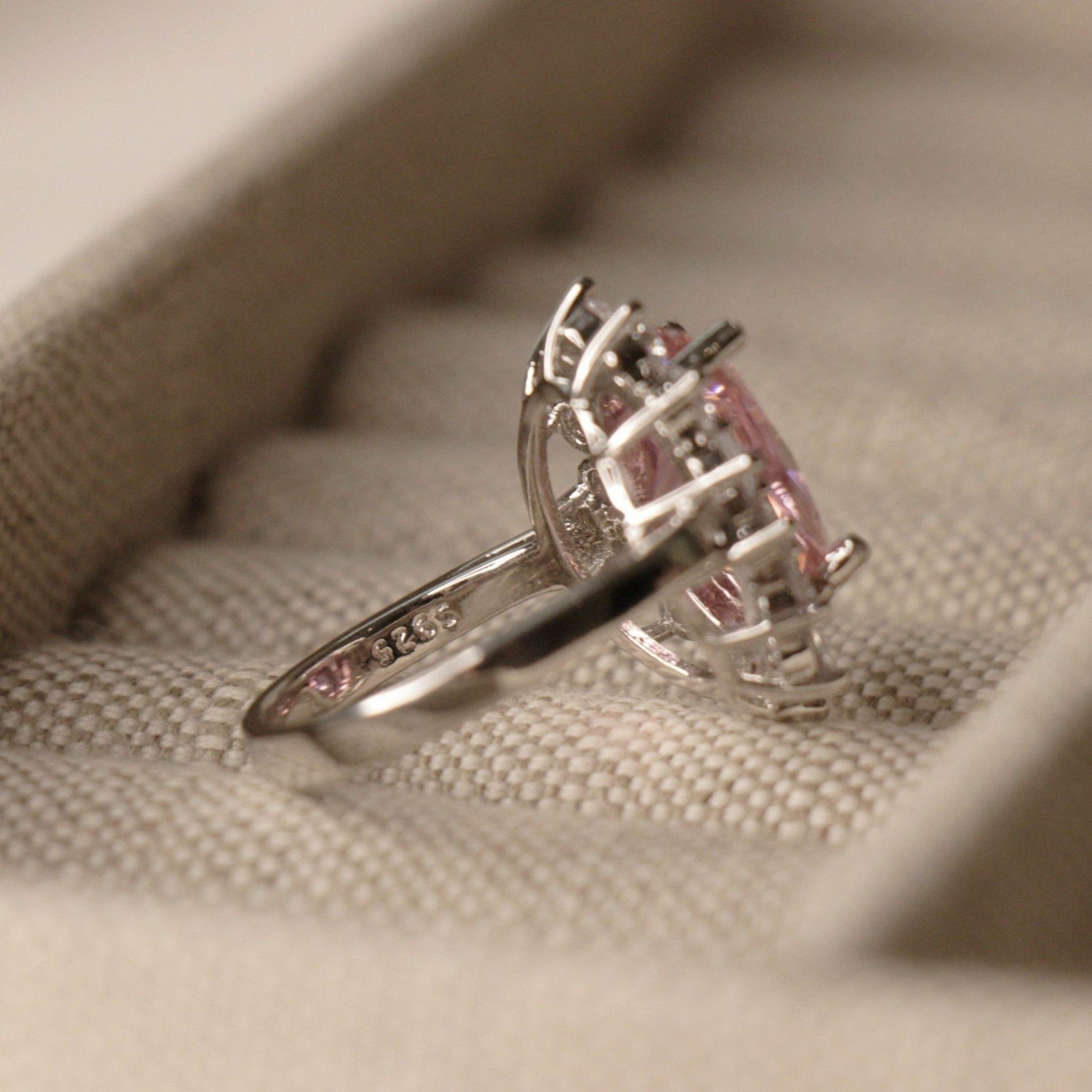 Pink oval sapphire halo cocktail ring styling